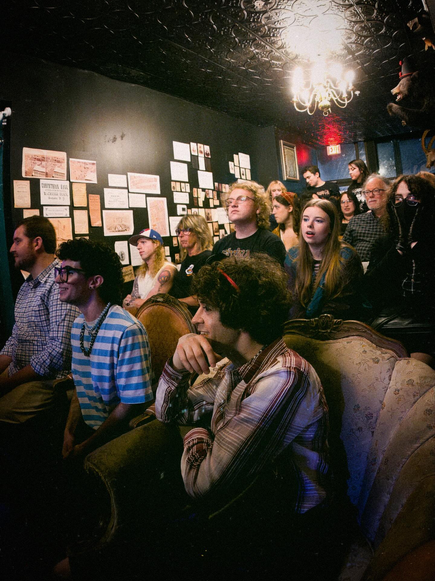 The audience witnesses the spectacle, engrossed and grossed out.